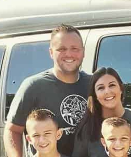 Jake Cain with family on the road