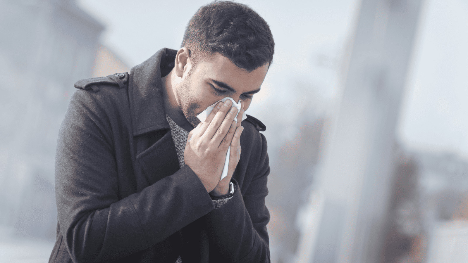 Man Blowing Nose