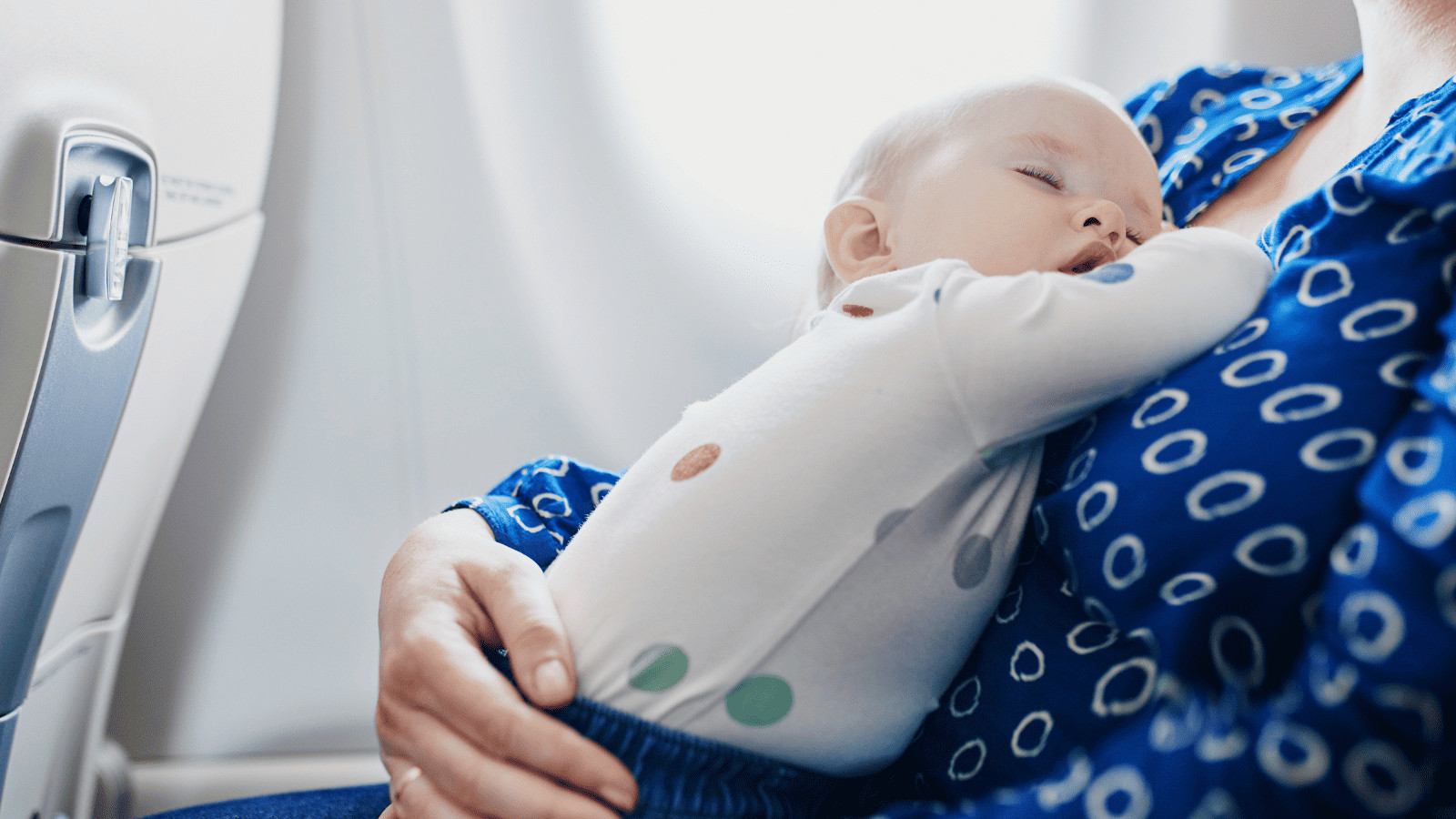 Family Travel Made Easy: Top Tips for Traveling With Kids 8 Child Sleeping on a Plane