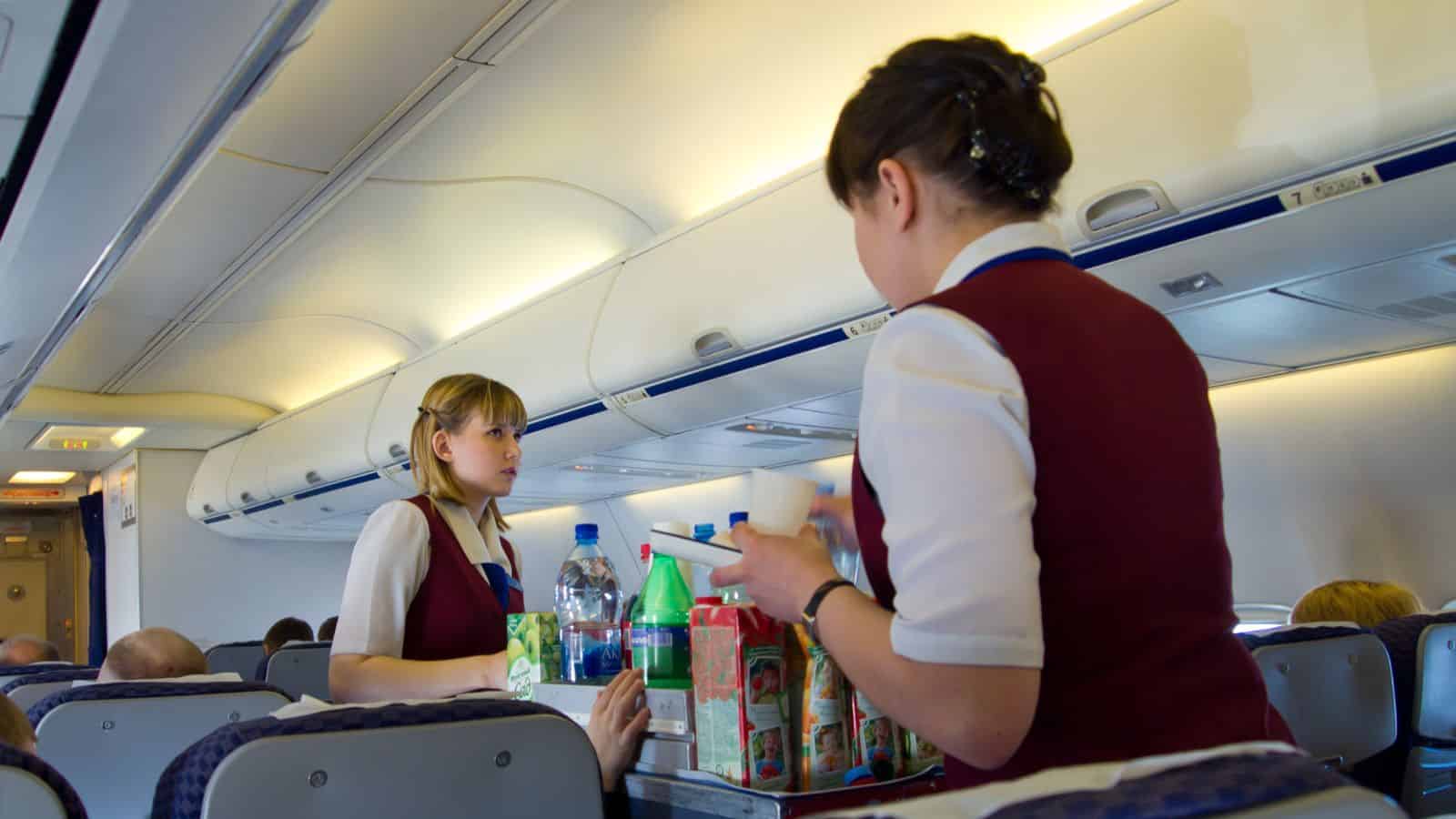 Flight Attendants Serving Food