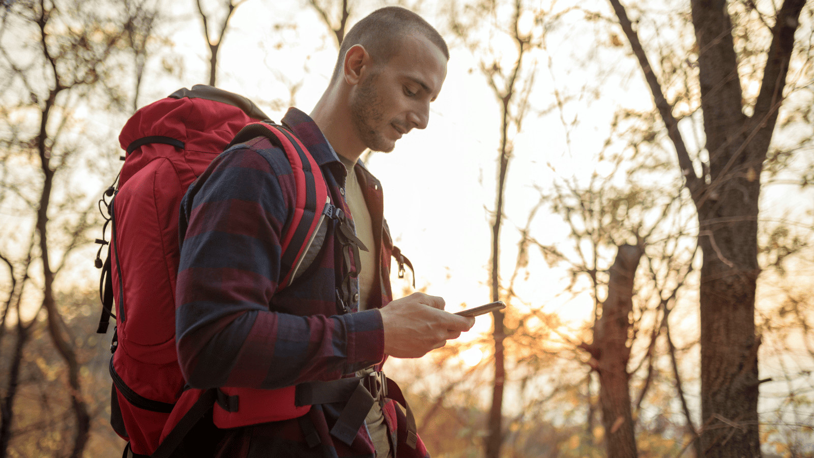 9 Game-Changing Hacks for Summer National Park Trips 3 Man Hiking with Phone