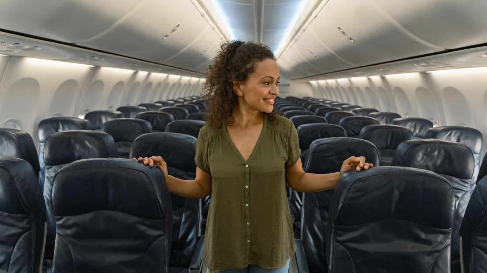 Passenger between aisles on plane