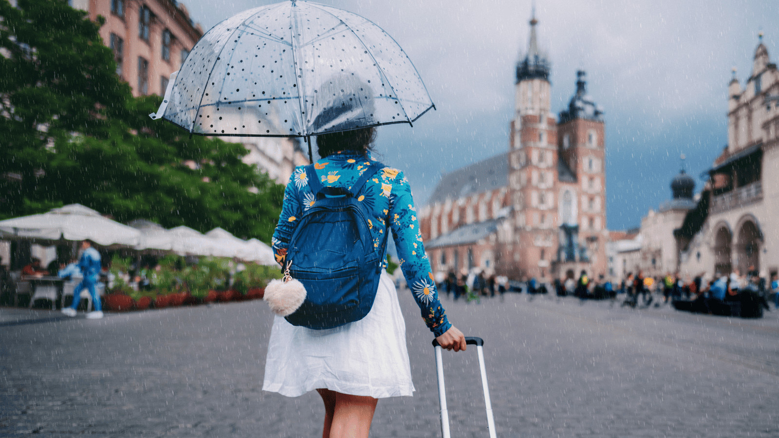 Uncover 11 Must-Have Summer Travel Accessories 6 Woman holding umbrella while traveling