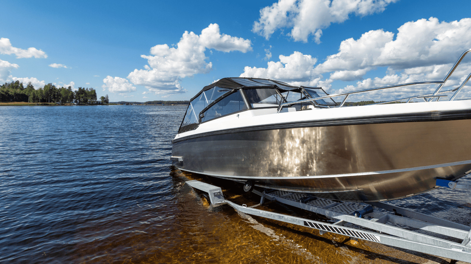 Boat launch on lake water from trailer