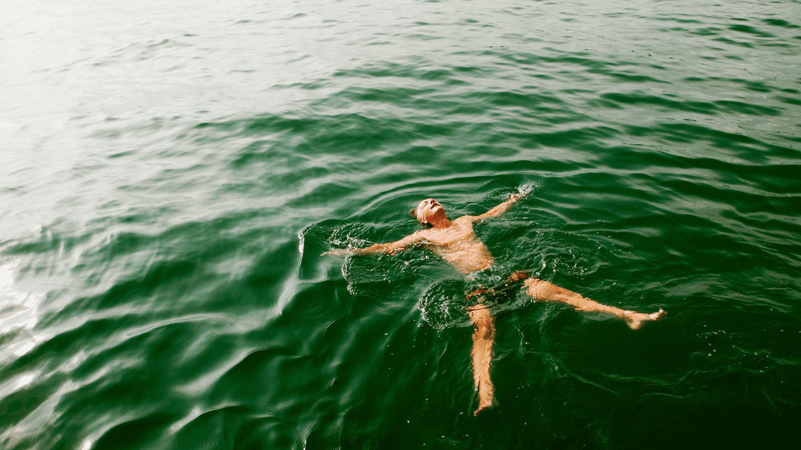 Man swimming in water