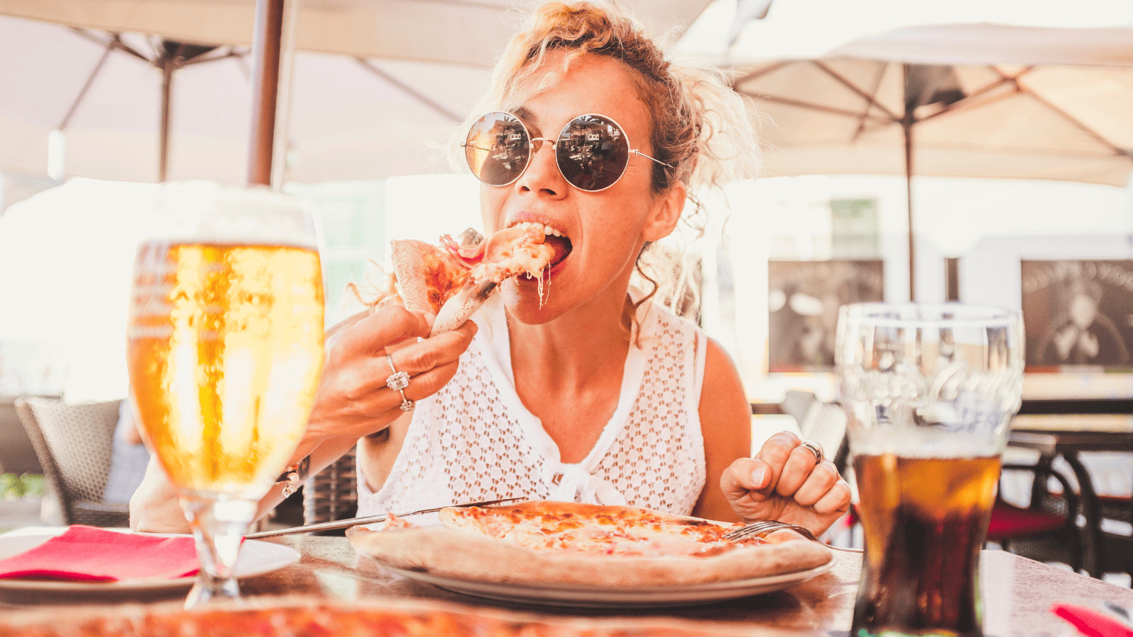 10 Secret Strategies to Love Your Long Layover 2 Woman Eating Pizza