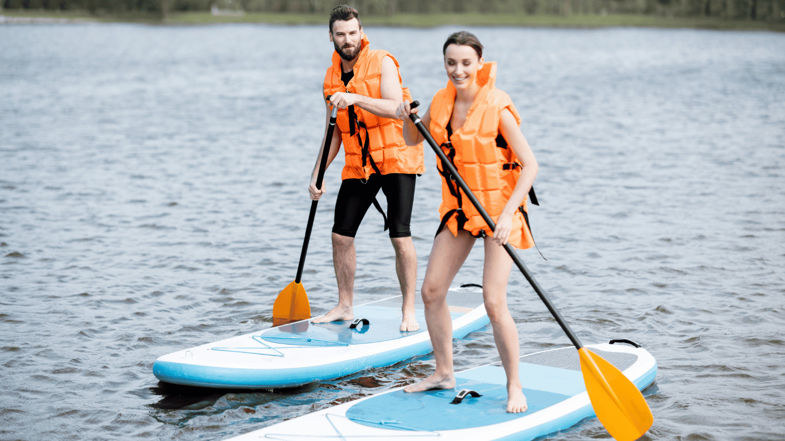Top 12 Lakes Near Cincinnati Well Worth Visiting 8 Man and woman paddle boarding