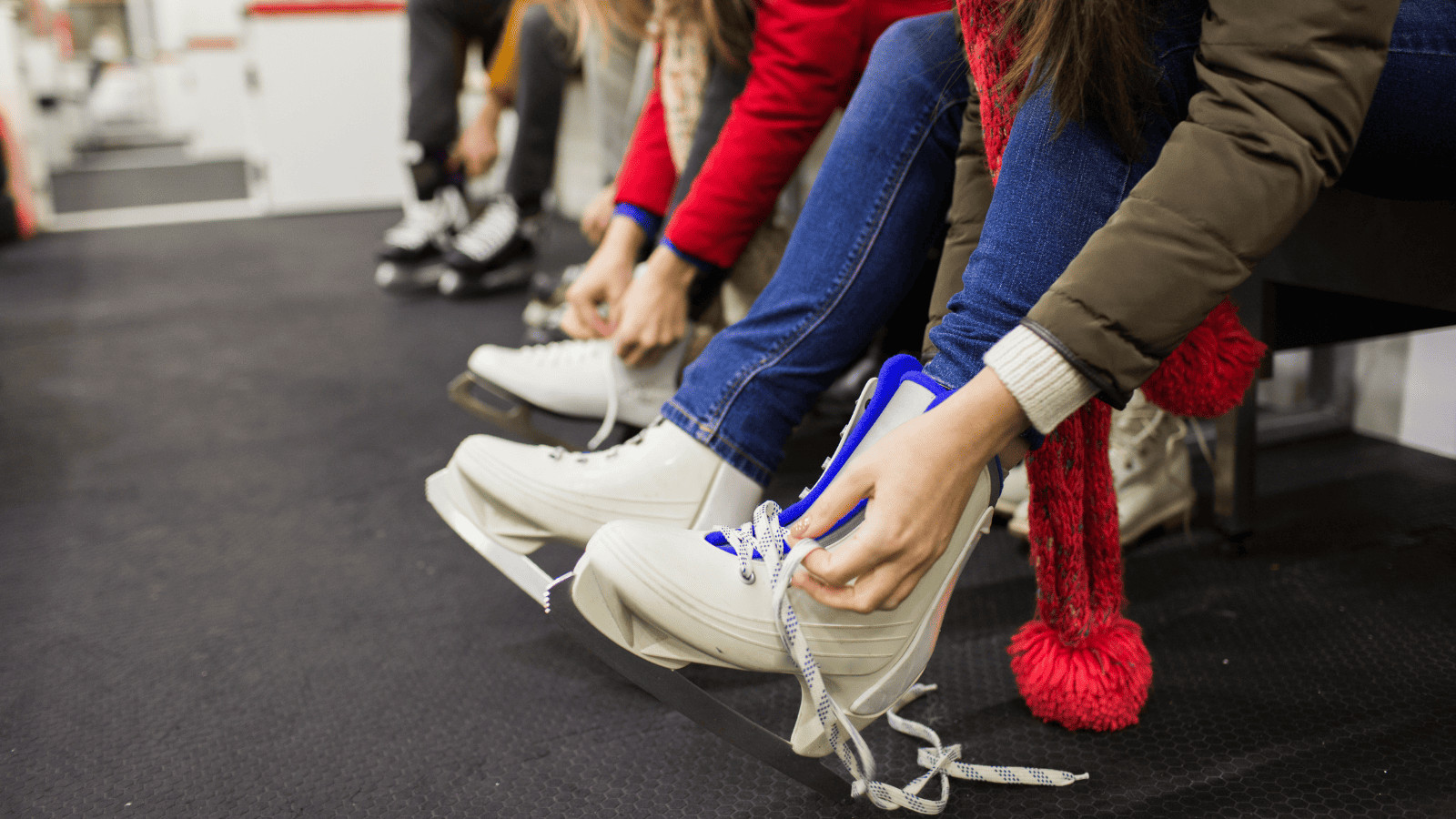 Barcelona in Winter: Can't-Miss Activities for a Great Trip 7 Person lacing up ice skating skates