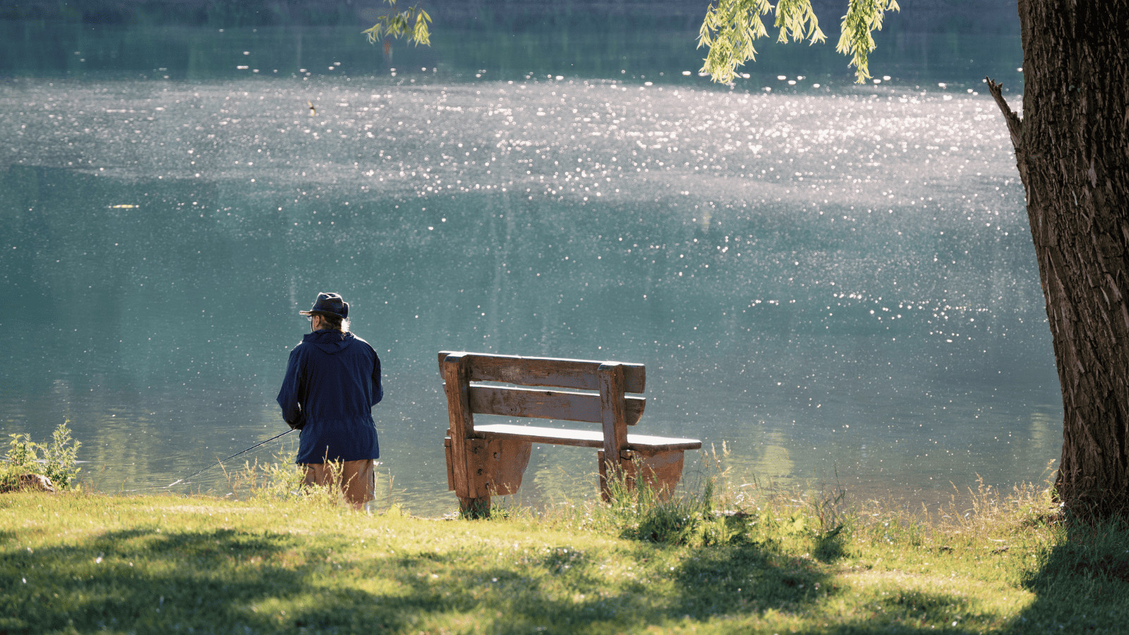 Man fishing by a lake