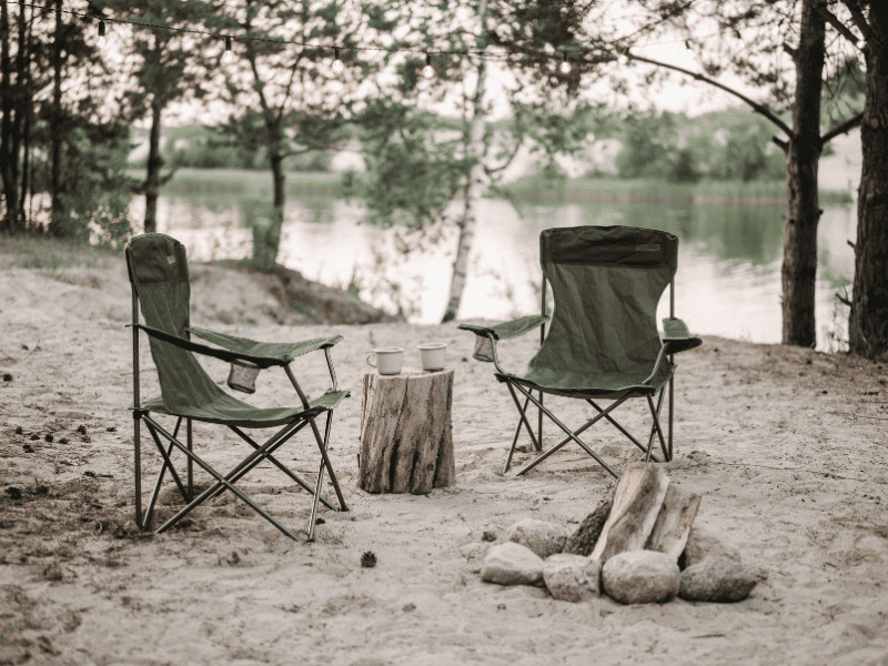 Camping chairs next to lake
