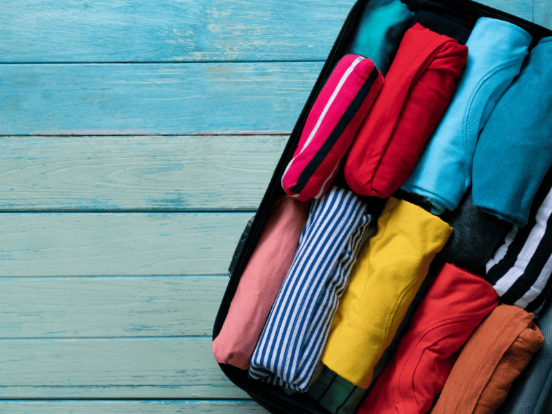 Beware: These 10 Terrible 'Travel Hacks' Could Ruin Your Trip 2 Rolled clothes in suitcase - terrible travel hacks