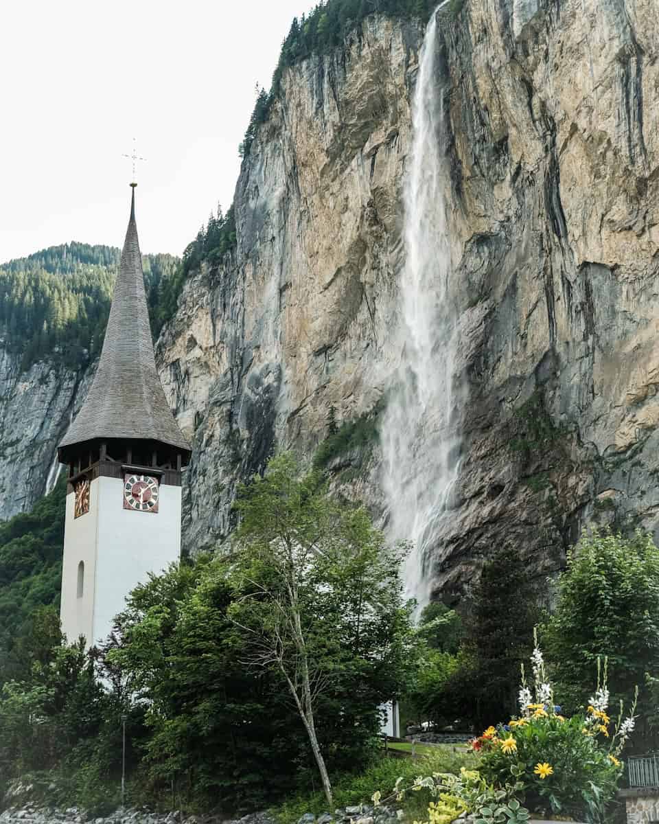 A church with a waterfall in the background