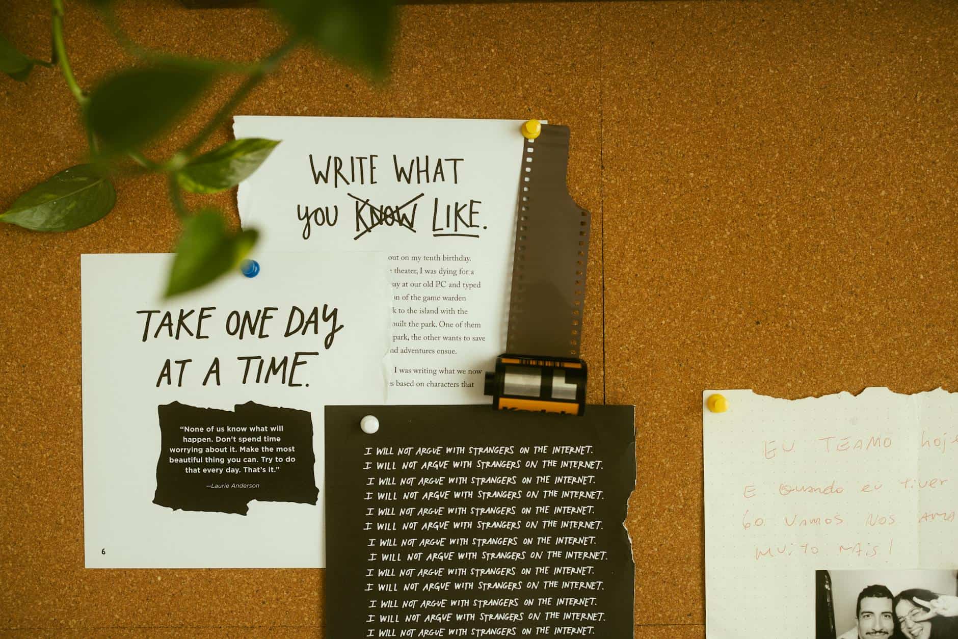 15 Road Trip Car Organizers for Traveling With Kids 11 A corkboard with motivational quotes, notes, and film negatives, fostering creativity and reflection.