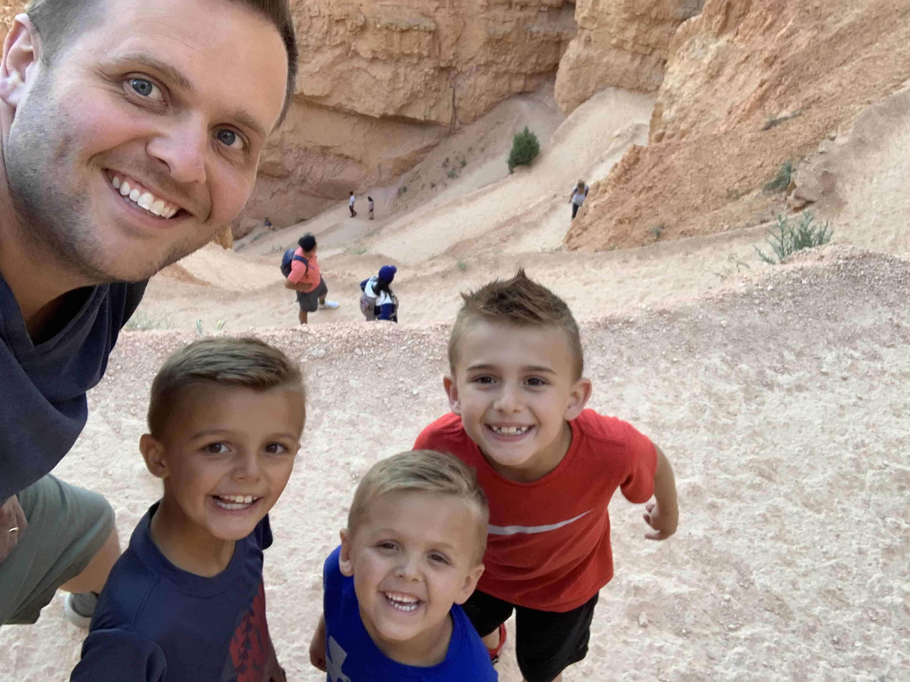 Bryce Canyon After Dark: The Most Underrated Mighty 5 Stop 4 Jake and the kids smiling on the Navajo Loop Trail at Bryce Canyon
