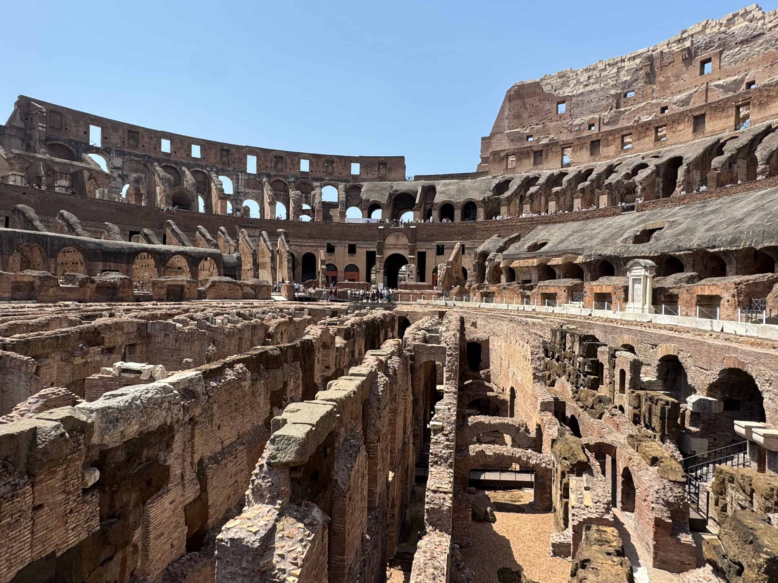 The stone arches and ruins inside the Colosseum